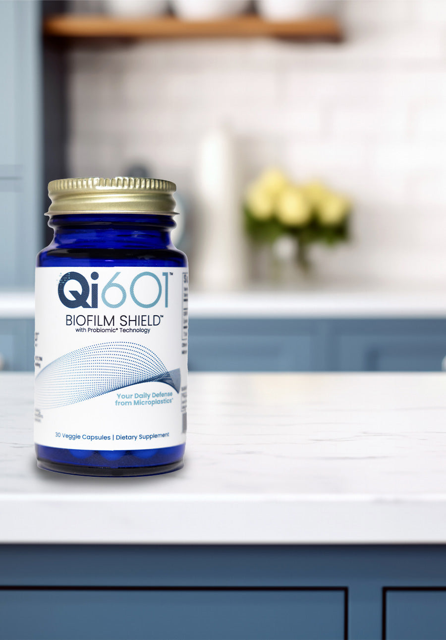 Qi601 Biofilm Shield supplement bottle on a kitchen counter